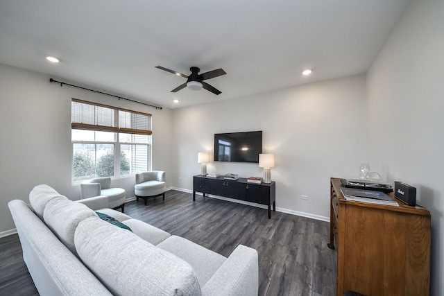 living room with dark wood-type flooring and ceiling fan