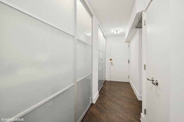 hallway featuring dark wood-type flooring