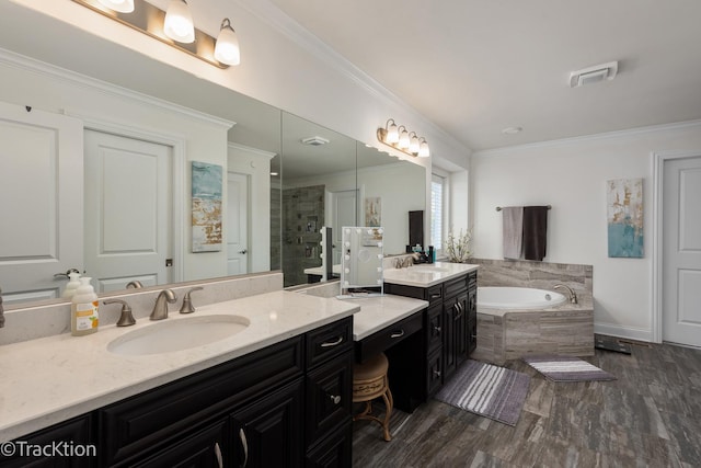 bathroom featuring crown molding, vanity, independent shower and bath, and hardwood / wood-style flooring