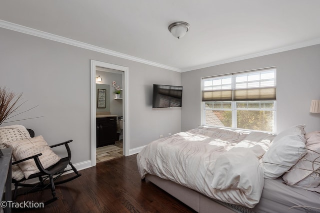 bedroom with crown molding, ensuite bath, and dark hardwood / wood-style flooring