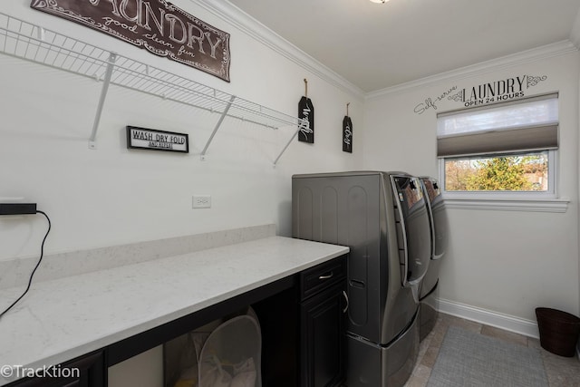 laundry area with ornamental molding and washer and dryer