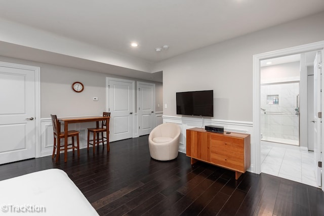 living room with dark hardwood / wood-style flooring