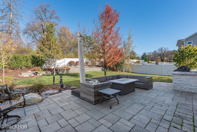 view of patio with an outdoor fire pit