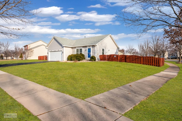 view of front facade featuring a garage and a front yard