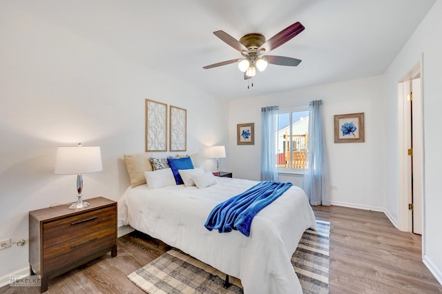 bedroom featuring ceiling fan and light hardwood / wood-style floors