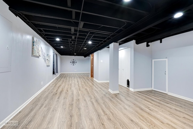 basement featuring light hardwood / wood-style flooring