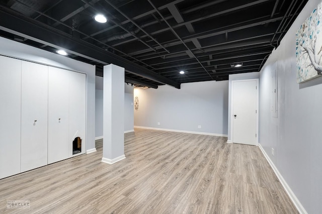 basement with light wood-type flooring