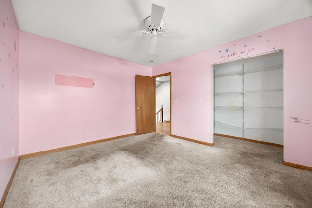 unfurnished bedroom featuring ceiling fan, carpet floors, and a closet