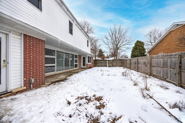 view of yard layered in snow