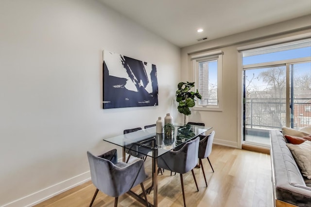 dining area featuring light wood-type flooring