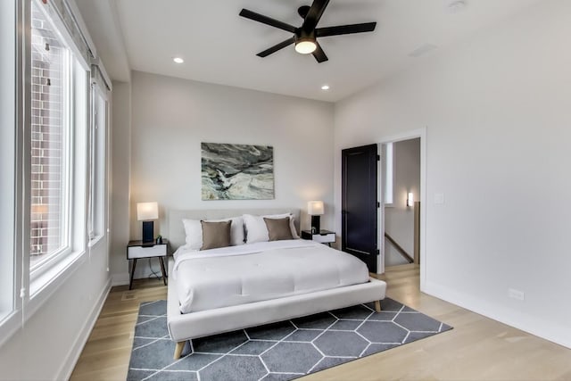 bedroom with hardwood / wood-style flooring and ceiling fan