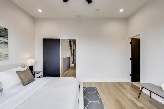 bedroom featuring hardwood / wood-style floors and ceiling fan