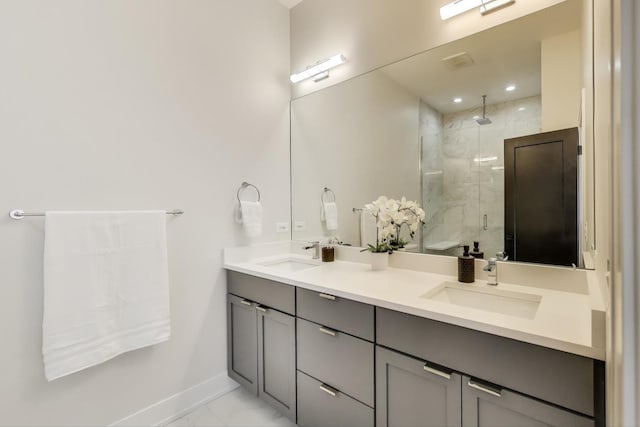 bathroom featuring vanity and an enclosed shower