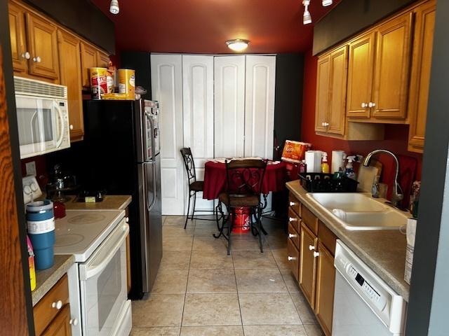 kitchen with sink and white dishwasher