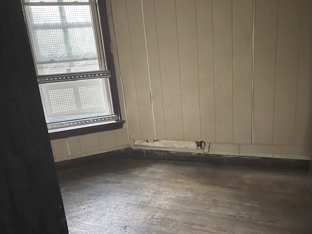 spare room with wood finished floors