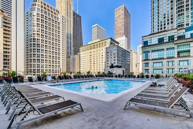 view of swimming pool with a patio area