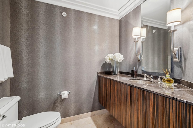 bathroom with vanity, tile patterned floors, crown molding, and toilet