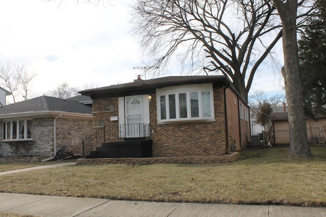 17544 Roy St, Lansing, IL 60438 - view of front of house with a front lawn and central air condition unit