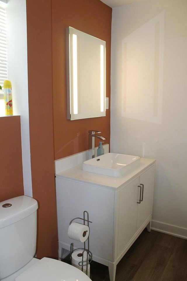 17544 Roy St, Lansing, IL 60438 - bathroom with vanity, toilet, and wood-type flooring