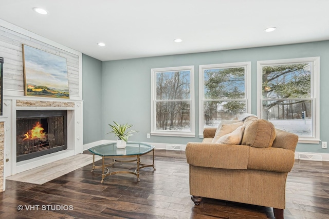 living area featuring a wealth of natural light and wood finished floors