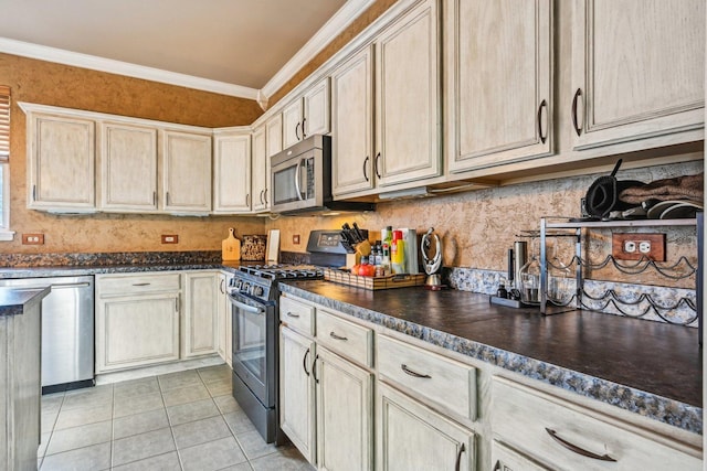 kitchen with backsplash, ornamental molding, light tile patterned flooring, and appliances with stainless steel finishes