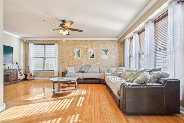 living room featuring crown molding, ceiling fan, and hardwood / wood-style floors