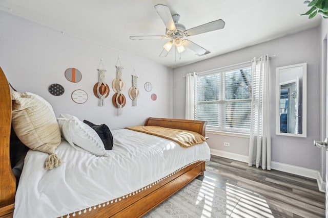 bedroom featuring dark wood-type flooring and ceiling fan