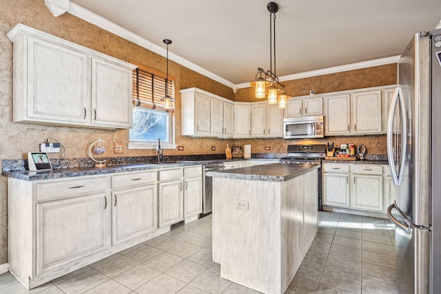 kitchen with a center island, hanging light fixtures, light tile patterned floors, ornamental molding, and appliances with stainless steel finishes