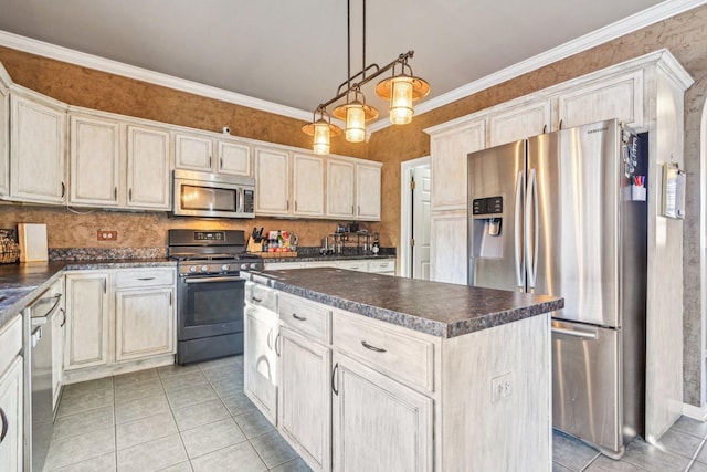 kitchen featuring crown molding, decorative light fixtures, a center island, light tile patterned floors, and stainless steel appliances