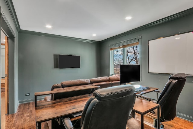 office area with crown molding and light hardwood / wood-style floors