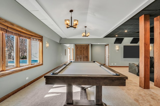 playroom with an inviting chandelier, vaulted ceiling, and light tile patterned floors