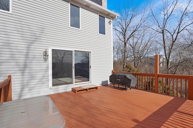 wooden terrace with area for grilling