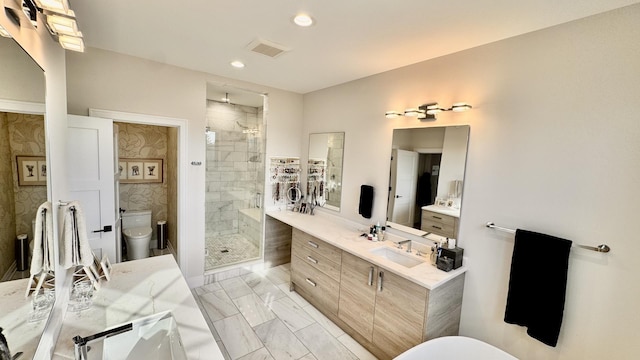 full bathroom featuring toilet, visible vents, vanity, marble finish floor, and a stall shower