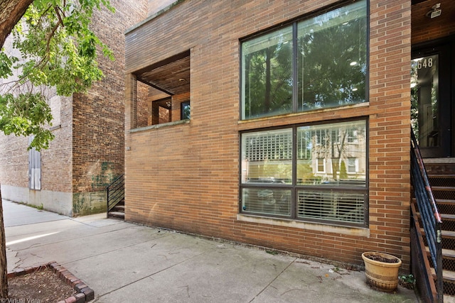 view of side of home with a patio area