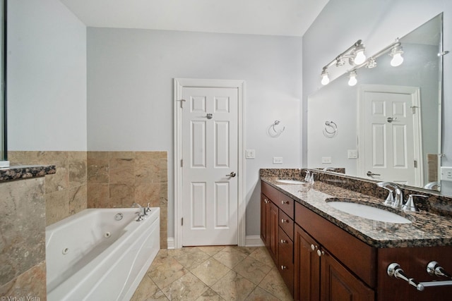 bathroom with vanity and a bath