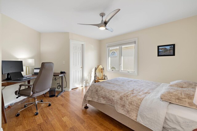 bedroom with ceiling fan and light hardwood / wood-style floors