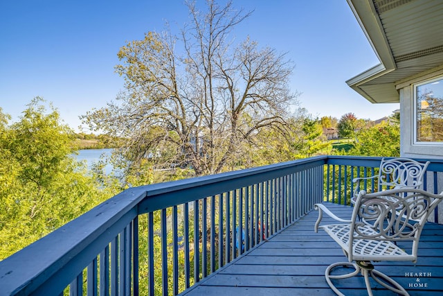 wooden deck featuring a water view