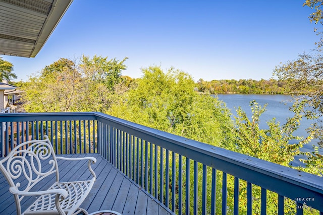 wooden deck with a water view