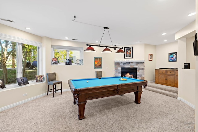 game room featuring a stone fireplace, light carpet, and billiards