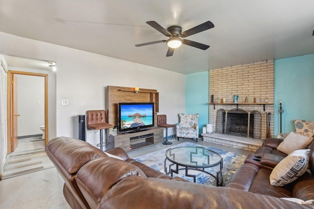 living room with a ceiling fan and a fireplace