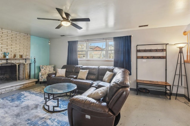 living area featuring visible vents, a brick fireplace, a ceiling fan, and finished concrete floors