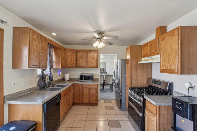 kitchen with ceiling fan, under cabinet range hood, brown cabinetry, stainless steel appliances, and a sink