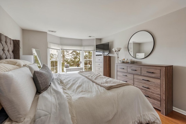 bedroom featuring hardwood / wood-style floors