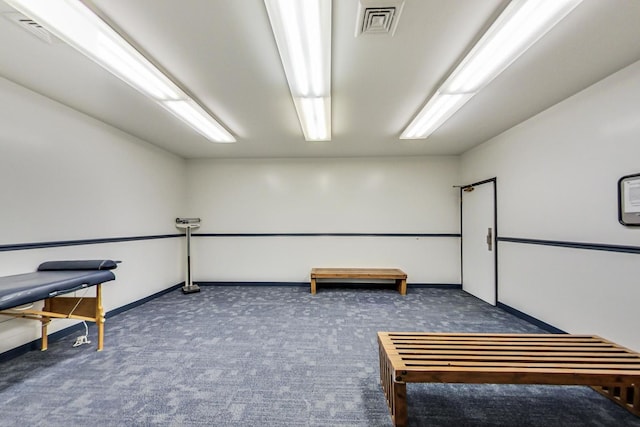 interior space featuring dark colored carpet