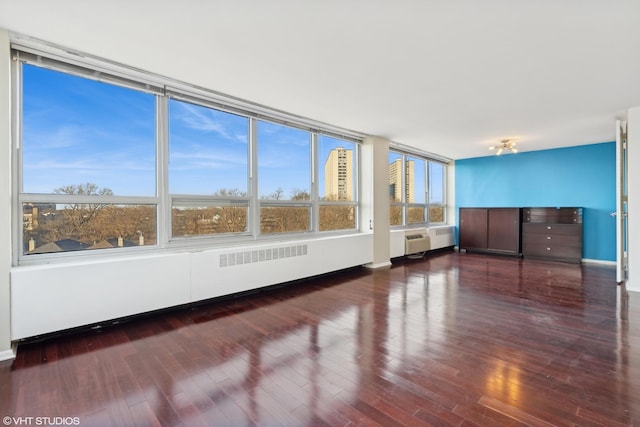 unfurnished sunroom featuring radiator