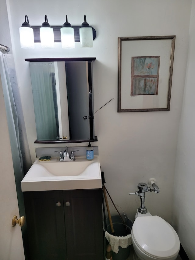 bathroom with vanity and toilet