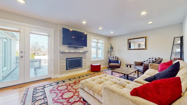 living room featuring french doors and hardwood / wood-style floors