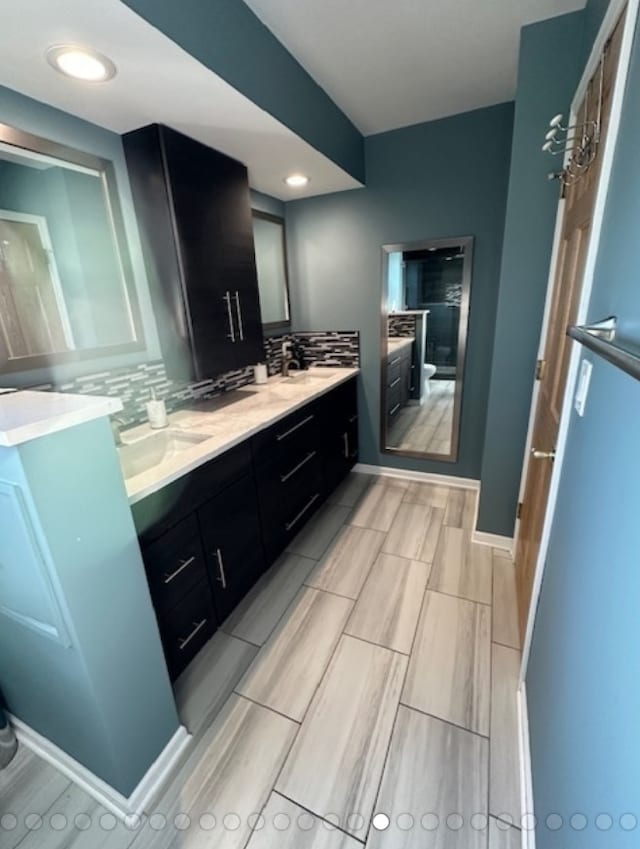 bathroom with vanity and backsplash