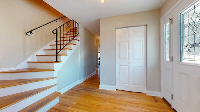 foyer entrance with light wood-type flooring