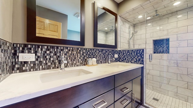 bathroom with a shower with door and vanity